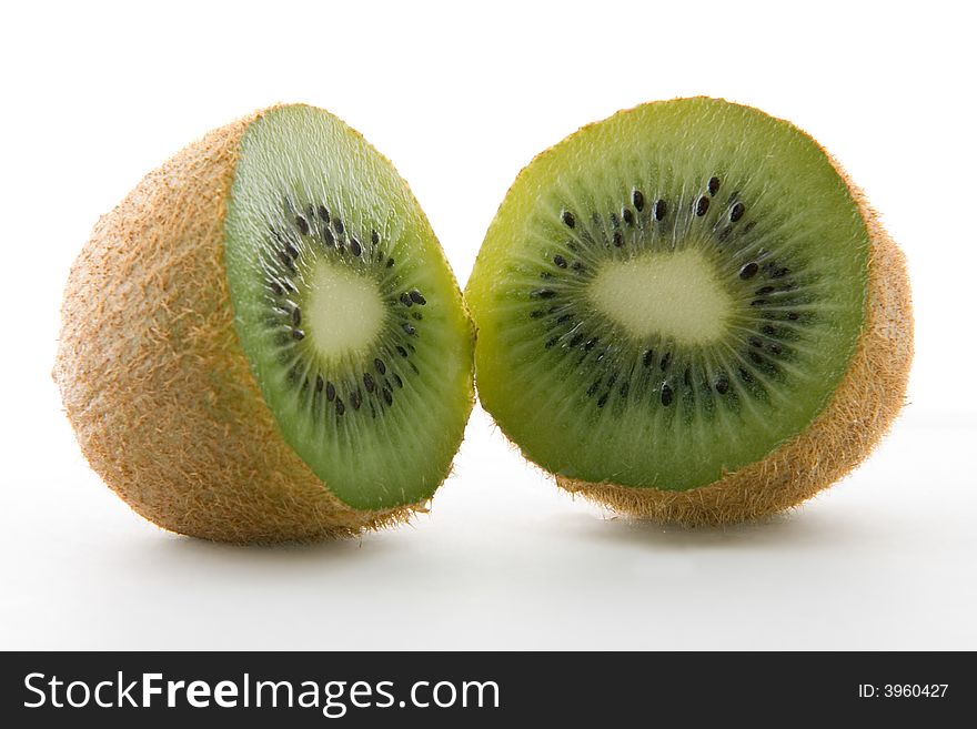 Two kiwi halves on white background