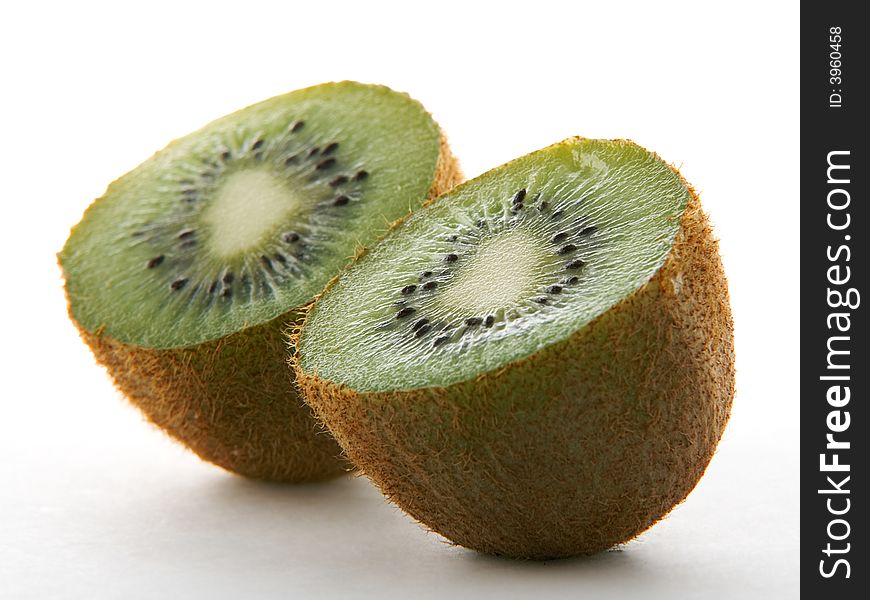 Two kiwi halves on white background