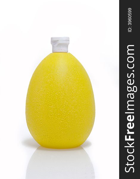 A Bottle Lemon concentrate on bright background