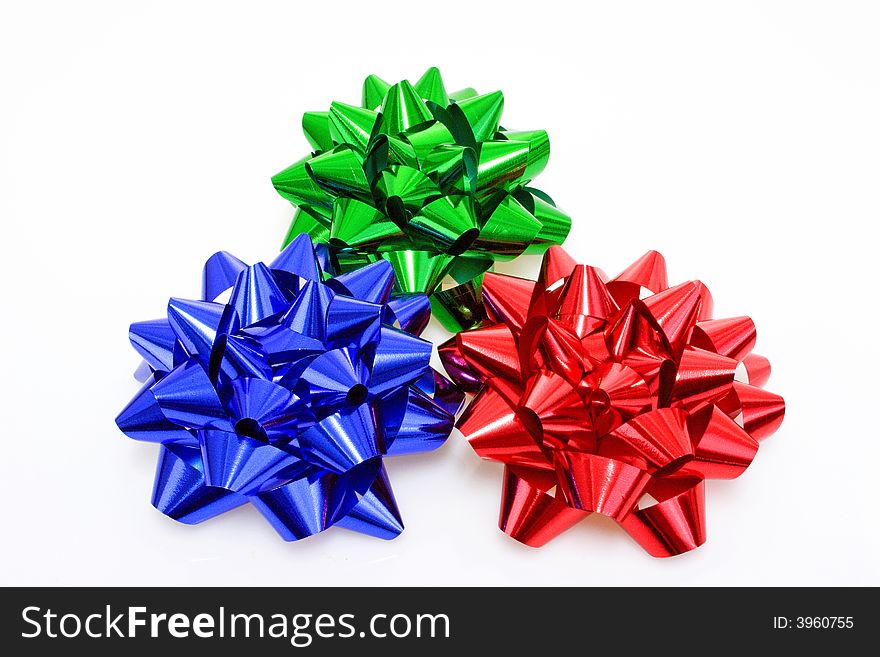 Three colurful Gift Bows on bright background