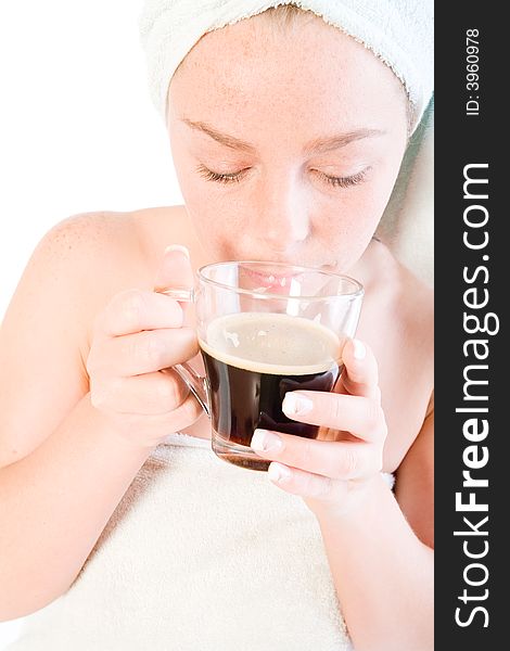 Studio portrait of a spa girl smelling her coffee. Studio portrait of a spa girl smelling her coffee