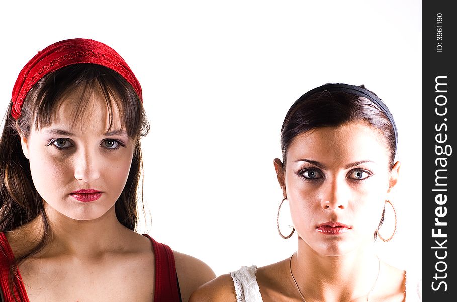 Two young women posing in the studio.