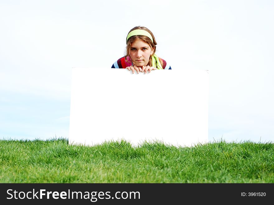 Young girl holding blank sign