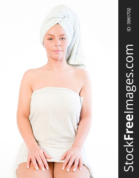 Studio portrait of a spa girl sitting and waiting. Studio portrait of a spa girl sitting and waiting