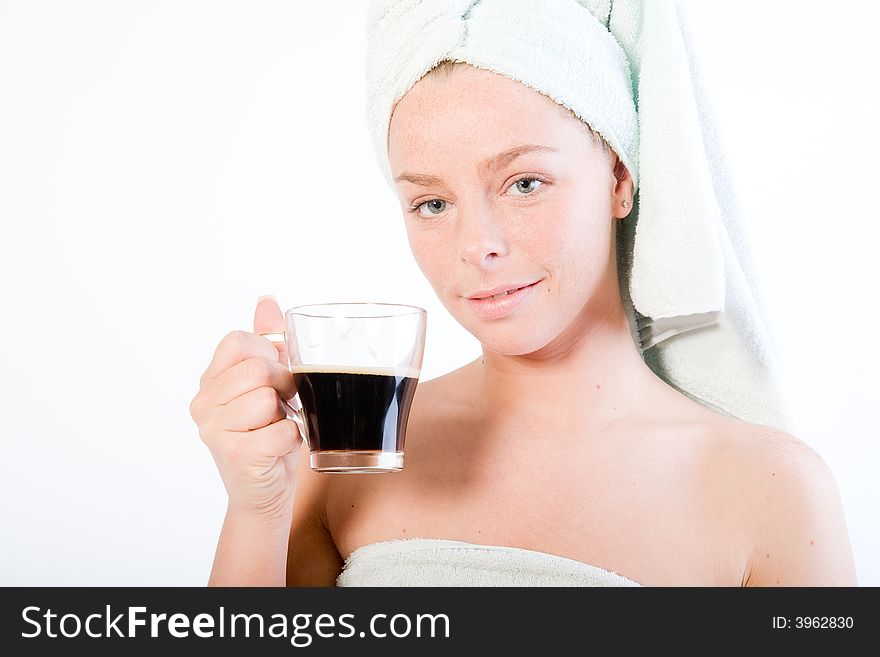 Studio portrait of a spa girl drinking coffee and making eye contact. Studio portrait of a spa girl drinking coffee and making eye contact