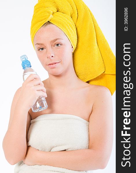 Studio portrait of a spa girl with a water bottle. Studio portrait of a spa girl with a water bottle