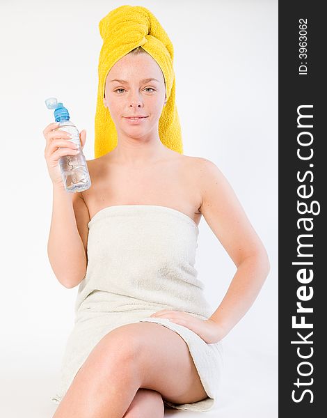 Studio portrait of a spa girl holding her water. Studio portrait of a spa girl holding her water