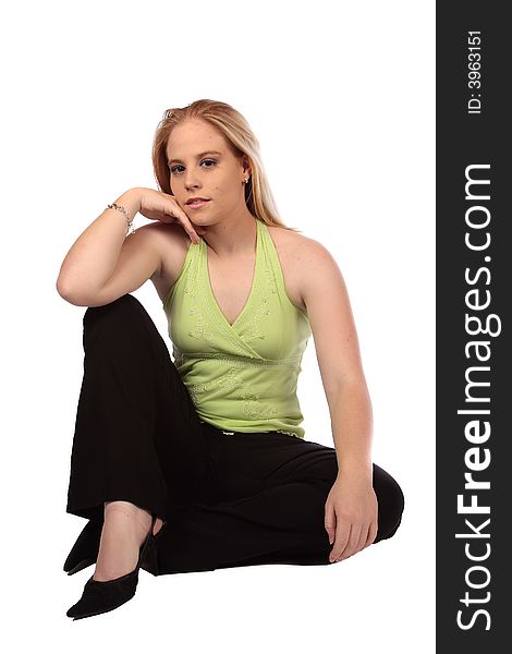 Model sitting on ground with one hand on knee. Model sitting on ground with one hand on knee
