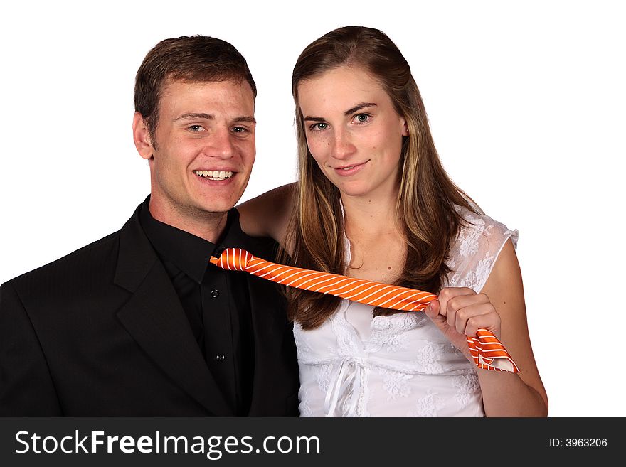 Young couple with lady pulling the man's tie. Young couple with lady pulling the man's tie