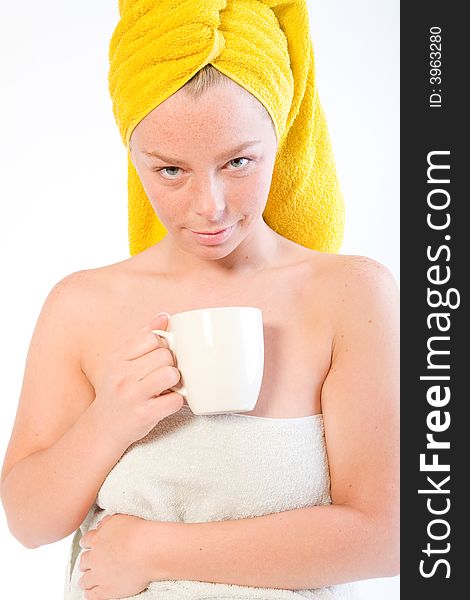 Studio portrait of a spa girl drinking coffee and watching. Studio portrait of a spa girl drinking coffee and watching