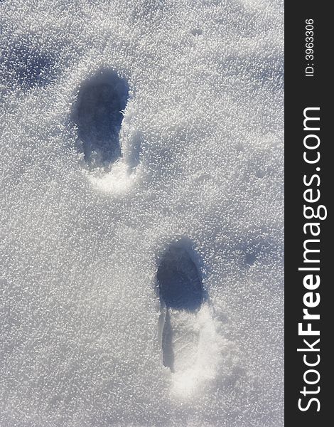 Two Tracks in snow, ice crystals visible