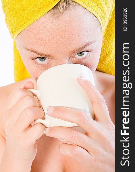 Studio portrait of a spa girl drinking coffee up close. Studio portrait of a spa girl drinking coffee up close