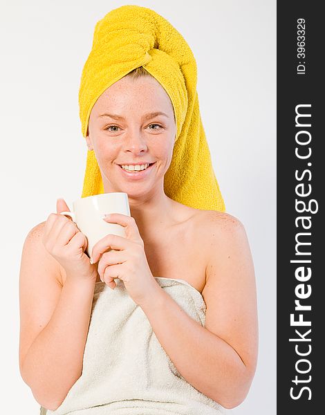 Studio portrait of a spa girl drinking coffee and listening. Studio portrait of a spa girl drinking coffee and listening