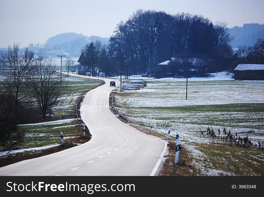 Winter road with snow covered landscape