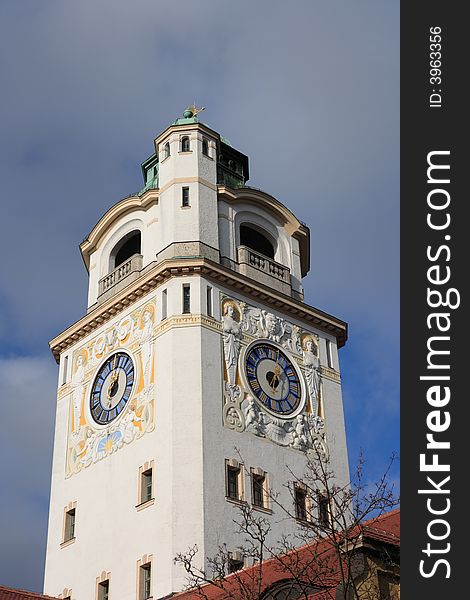 Steeple with clock at munich, germany