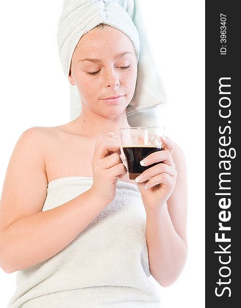 Studio portrait of a spa girl drinking coffee out of a glass. Studio portrait of a spa girl drinking coffee out of a glass