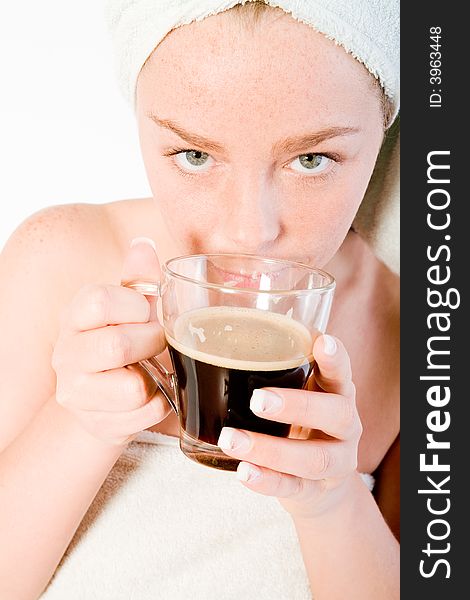 Studio portrait of a spa girl smelling her morning coffee. Studio portrait of a spa girl smelling her morning coffee