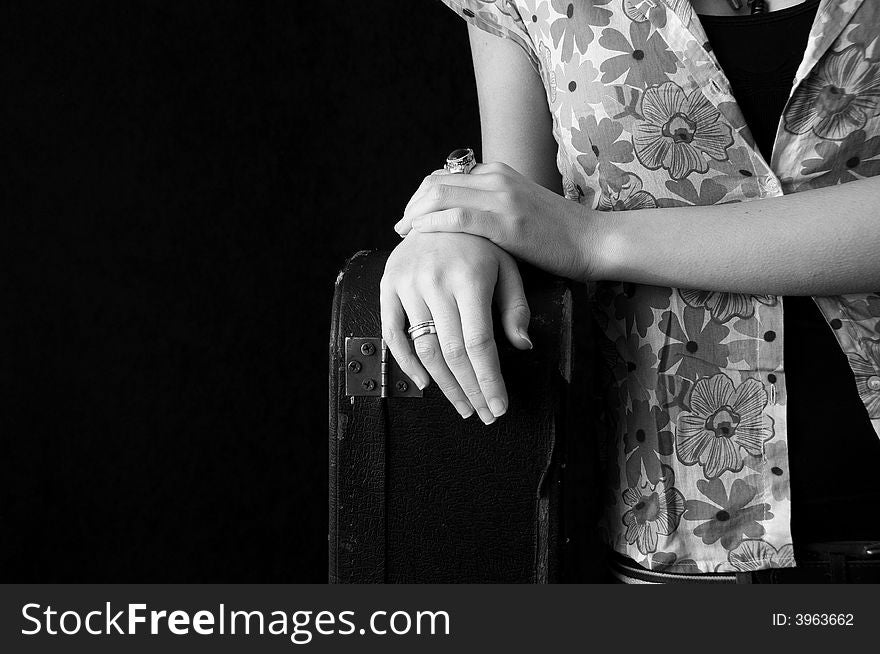 Girl on  black background with guitar box. Girl on  black background with guitar box