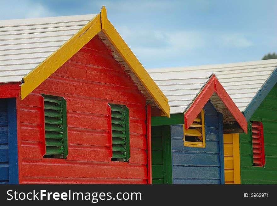 Famous changing huts for bathers on the beach at Muizenberg. Famous changing huts for bathers on the beach at Muizenberg.