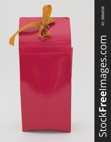 Photo of cardboard gift box with bow on cover