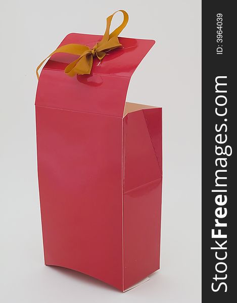 Photo of cardboard gift box with bow on cover