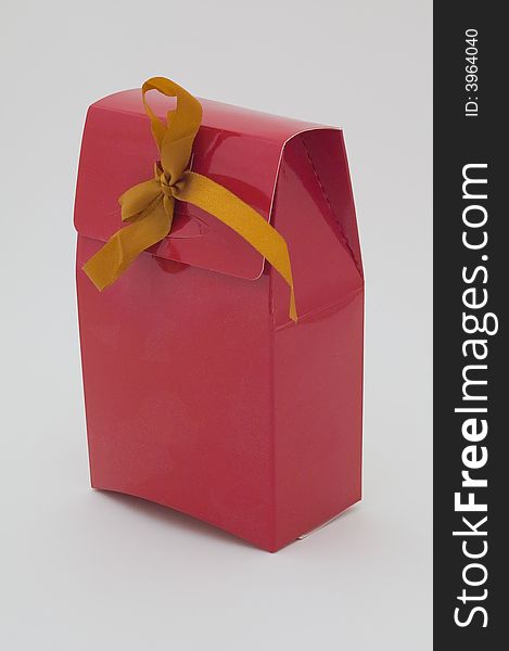 Photo of cardboard gift box with bow on cover