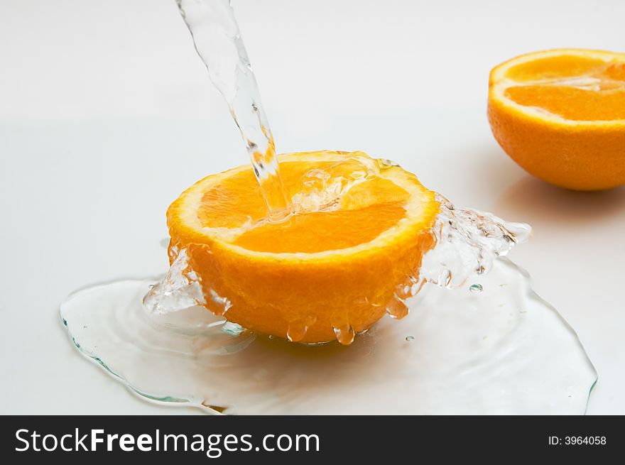 Two parts of an orange in water. Two parts of an orange in water