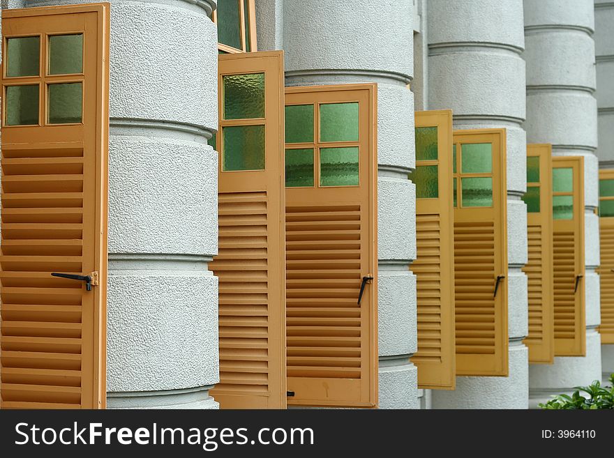 Series of yellow windows from a modern building.