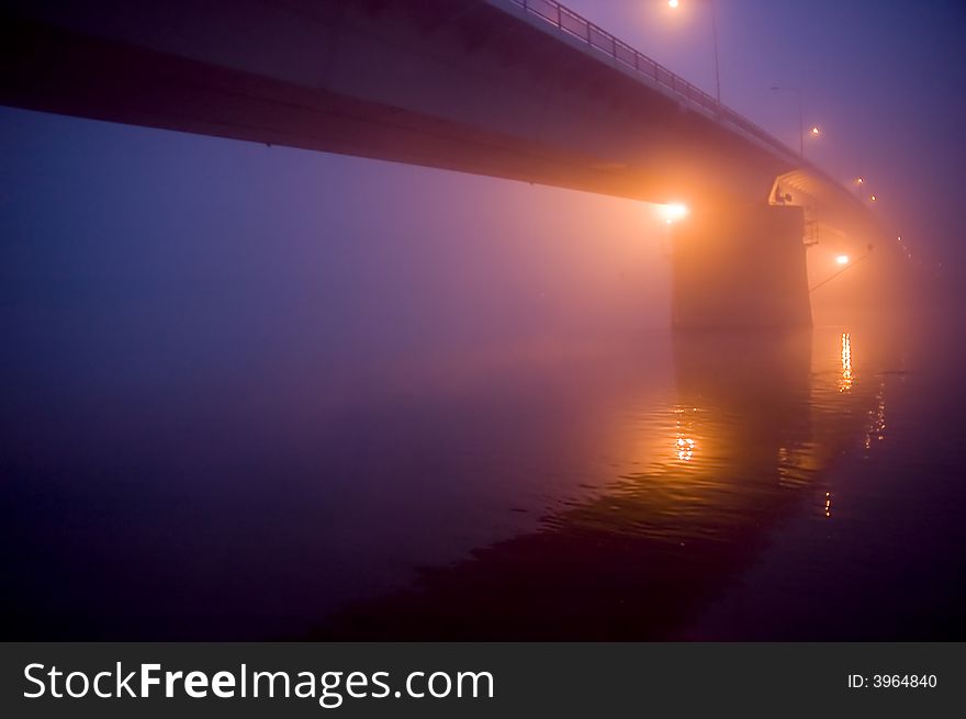 Bridge in the fog by night