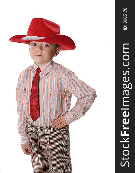 The cheerful boy in a cowboy's hat and a tie