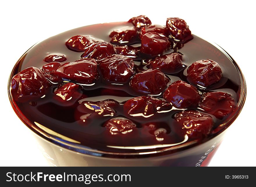 Sweet cherries jam in the transparent glass. Sweet cherries jam in the transparent glass