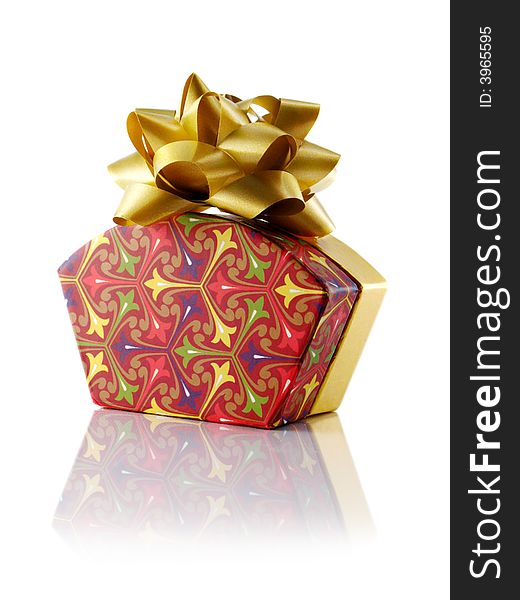 Fancy gift box with gold bow; Isolated with reflection. Fancy gift box with gold bow; Isolated with reflection