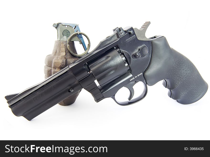Revolver And Vintage Grenade On White