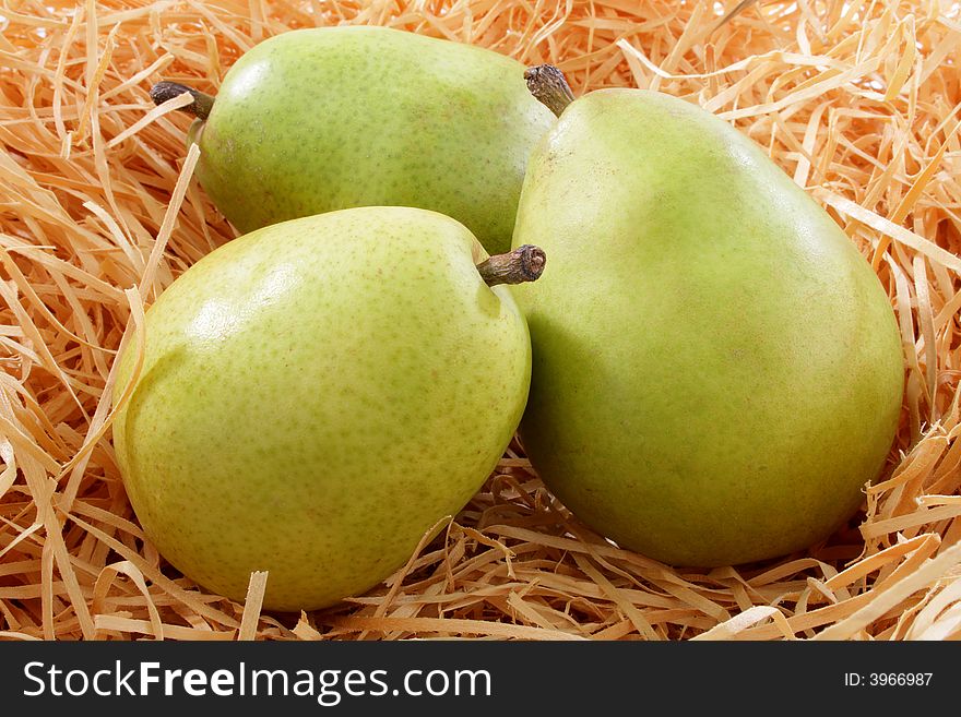 A group of pears on paper shipping material. A group of pears on paper shipping material