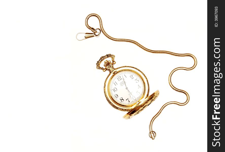 An antique gold pocket watch with chain and open lid. An antique gold pocket watch with chain and open lid.