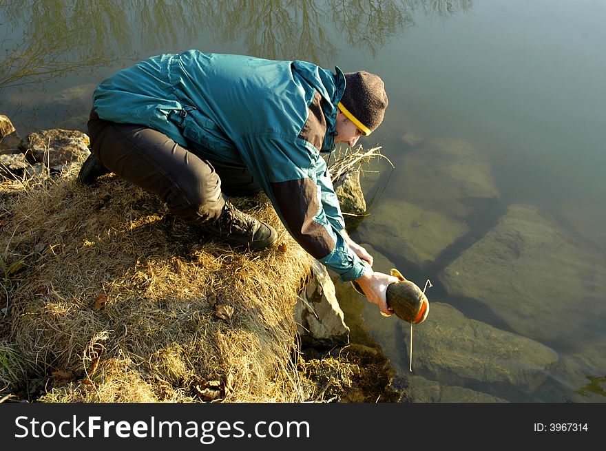 Kindly fisherman just giving freedom a fish