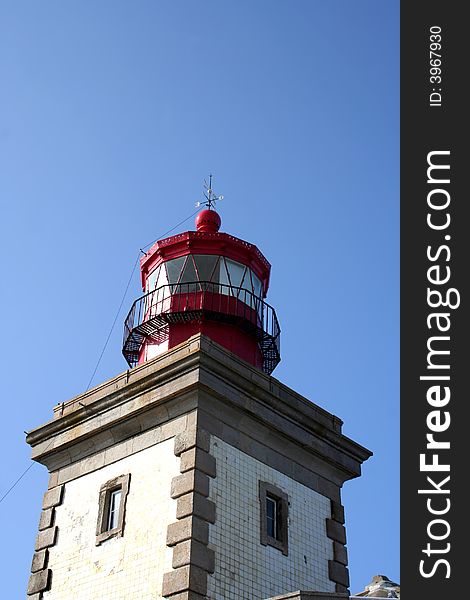 Detail from a lighthouse tower with a blue sky as background