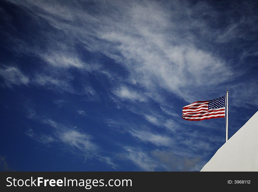 American flag with blue sky and white clould background. American flag with blue sky and white clould background