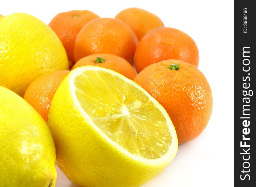 Ripe by mandarine orange and lemon tropic fruit isolated over white background with clipping path included. Ripe by mandarine orange and lemon tropic fruit isolated over white background with clipping path included