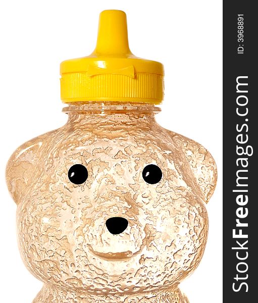 Macro of an empty plastic honey bear container with the textures of food residue illuminated from the back