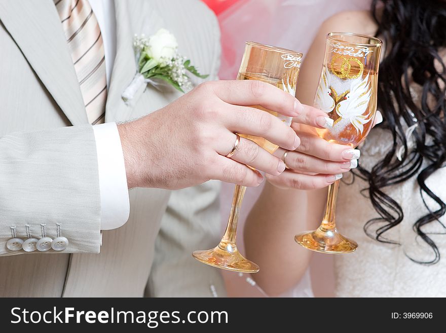 Newlywed couple with glasses