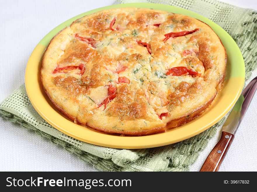 Omelet With Cheese, Tomato And Dill on the table