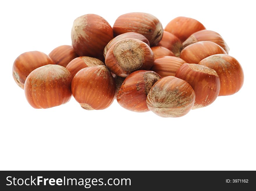 Heap of shelled hazelnuts isolated on white