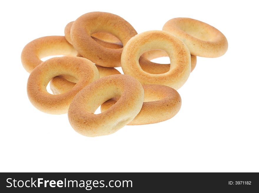 Heap of bagels isolated on white