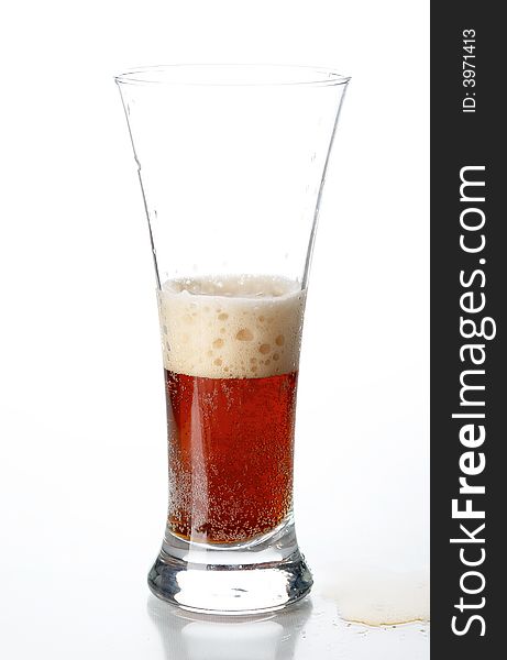 Glass with beer on the white background