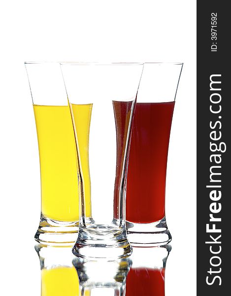 Glasses with juice on the white background