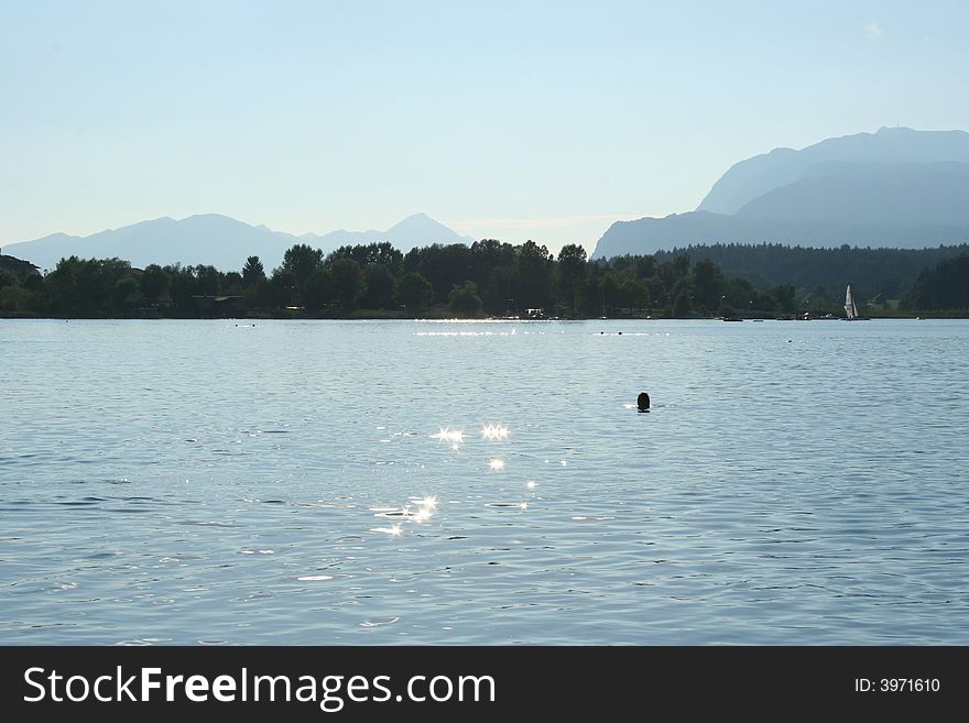 Swimming at the lake faakersee in Carinthia / Austria. Swimming at the lake faakersee in Carinthia / Austria