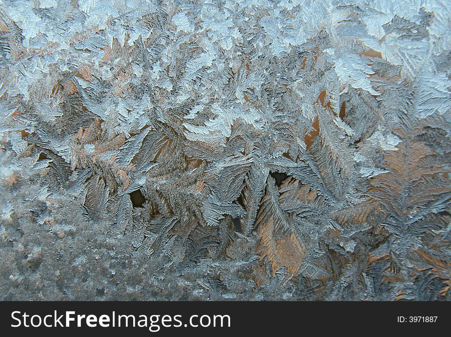 Ice patterns on frosty window. Ice patterns on frosty window.