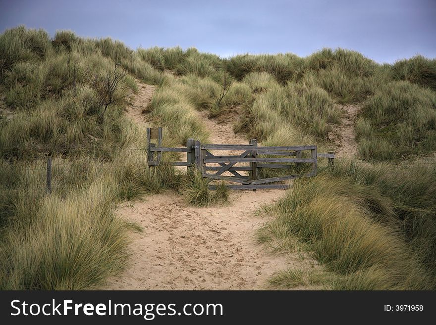 Beach path and sand dunes Bamburgh North East England