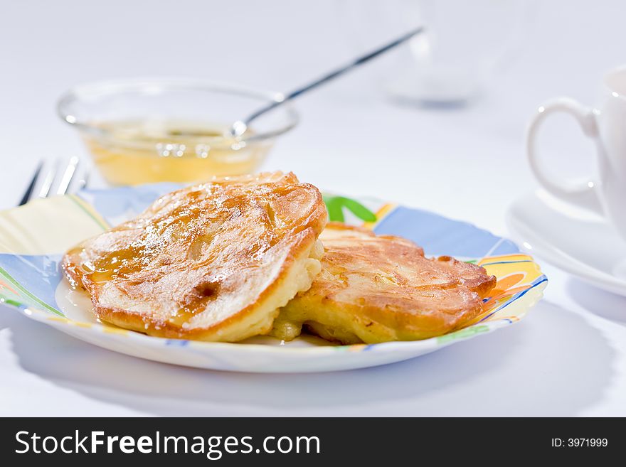 Two pancakes with honey on plate, lunch. Two pancakes with honey on plate, lunch